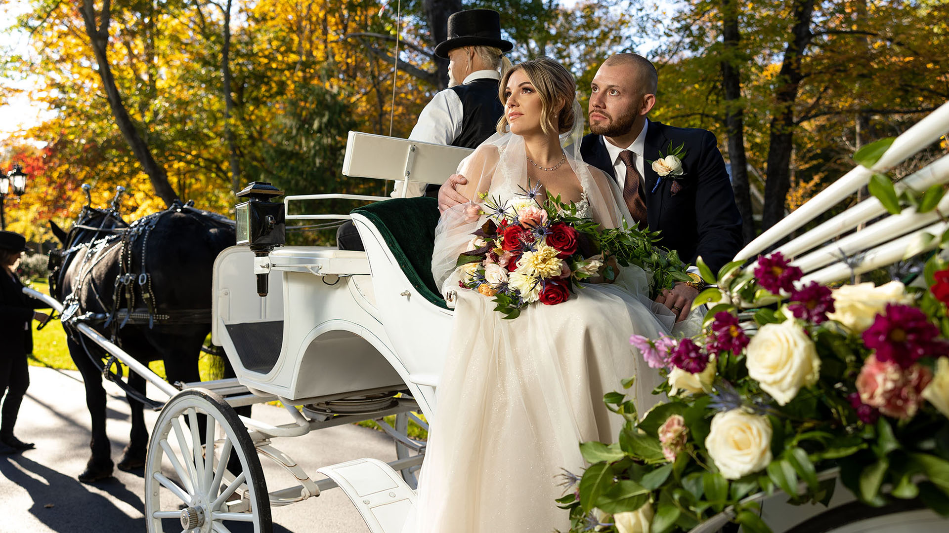 wedding couple on coach ride at William Mason House Banner Image